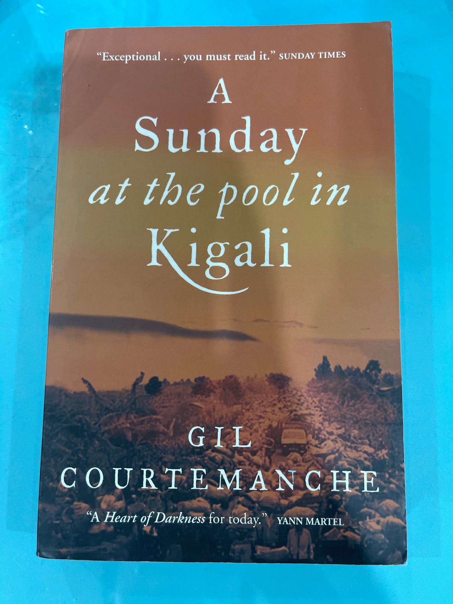 A Sunday at the pool in Kigali - Gil Courtemanche